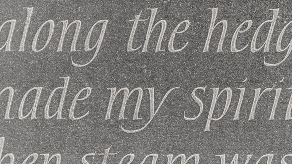 close up of words engraved into headstone